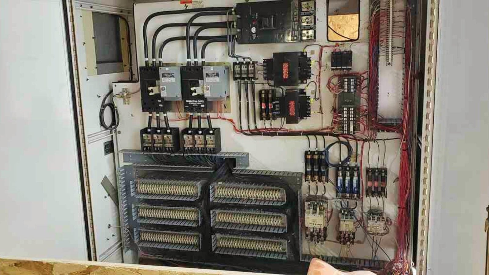 Basement renovation cost includes upgrading electrical panel and wiring for safety, lighting, and new appliance installations.