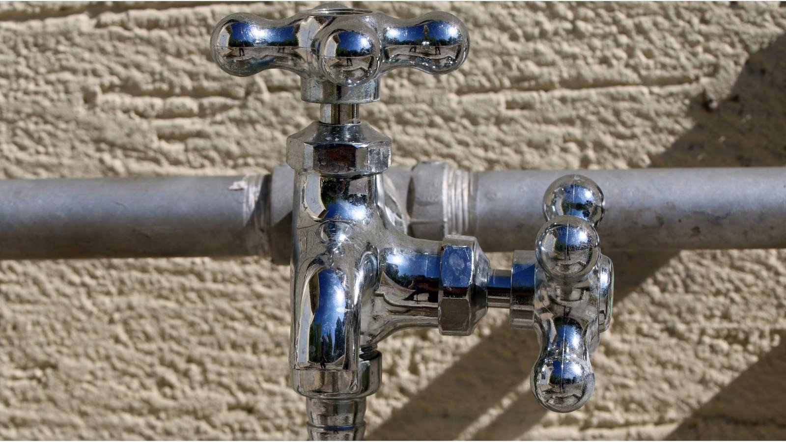 Chrome outdoor faucet with dual handles for basement bathroom water supply